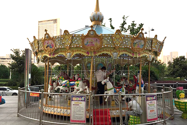 big luxury carousel with fence and double cornice