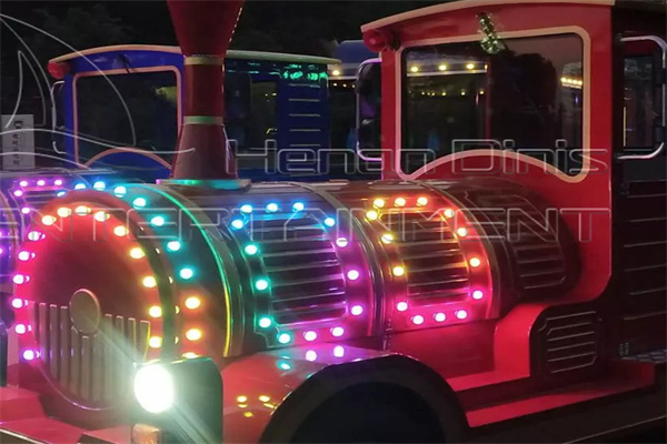 Dinis train set in night with colorful LED lights