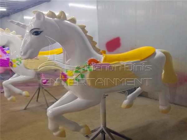 Unicorn carousel horse in white color