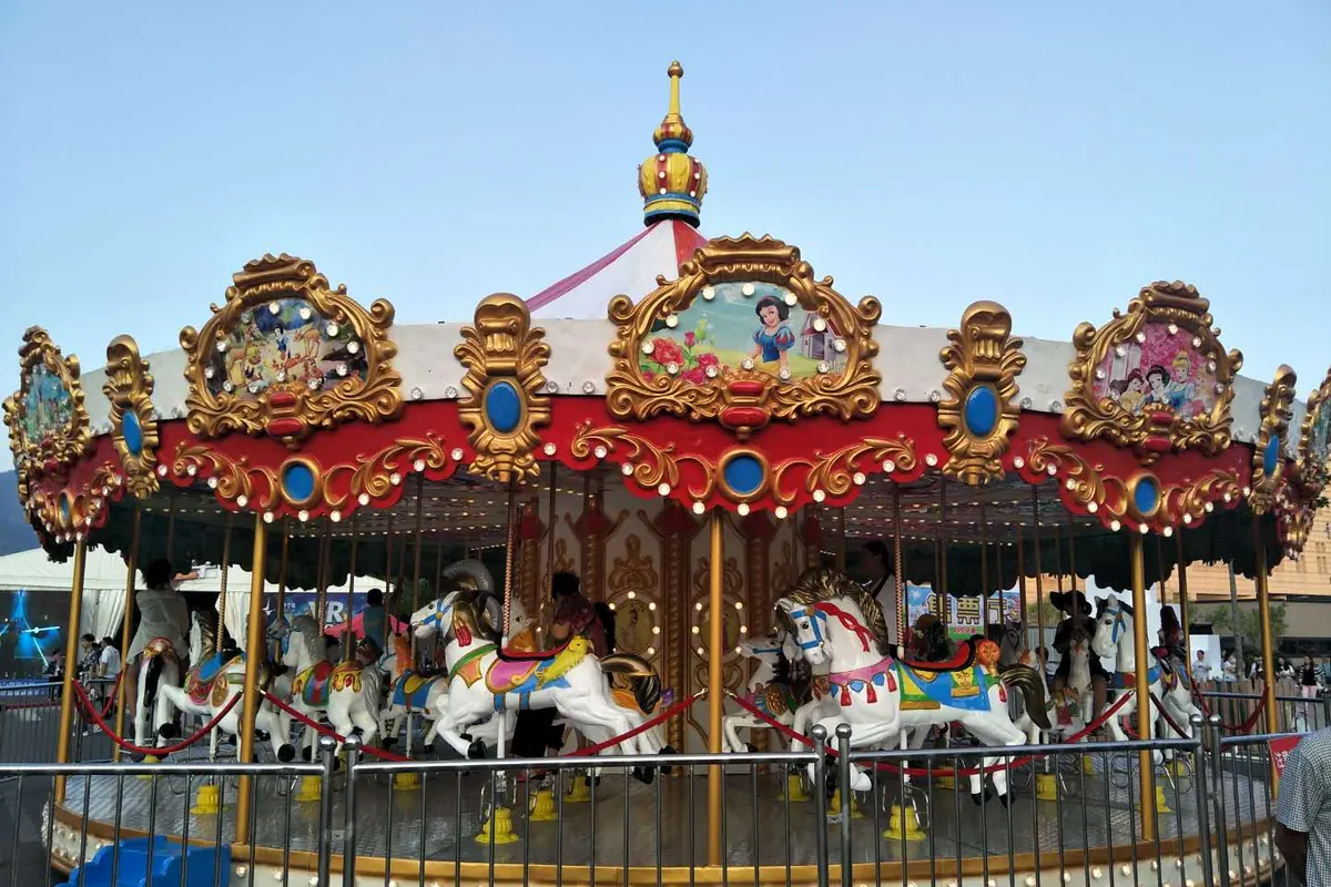 Carousel ride with LED lighting at an amusement park
