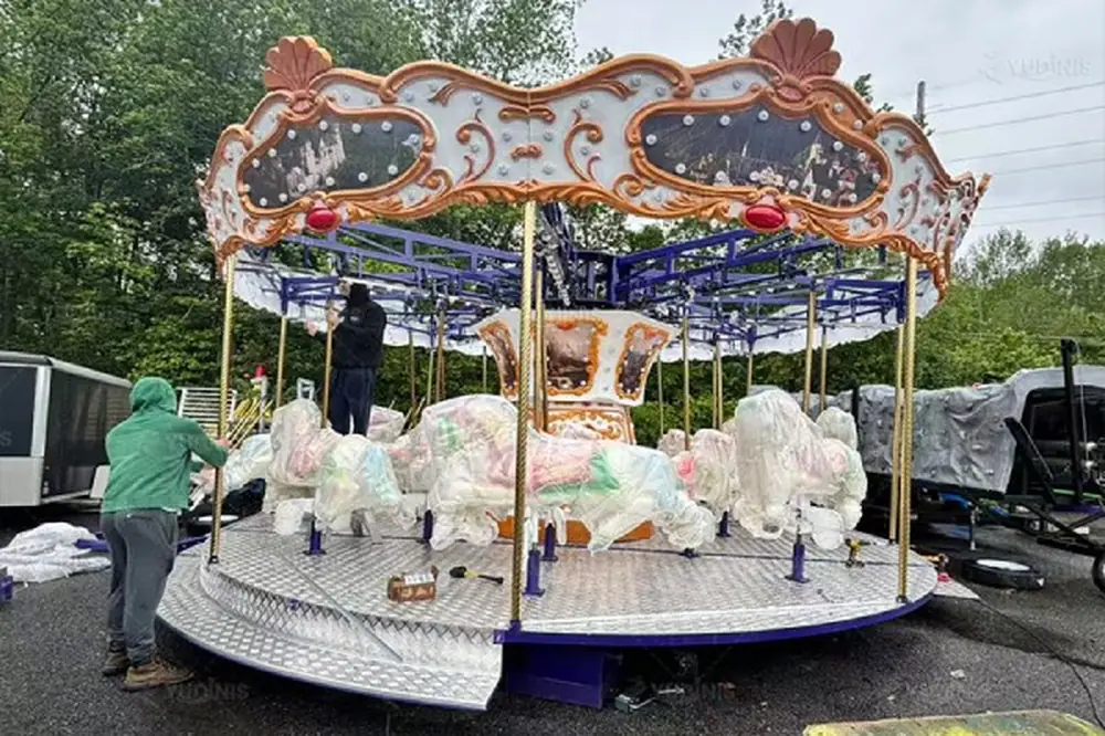 Children's carousel merry go round with lifting horses