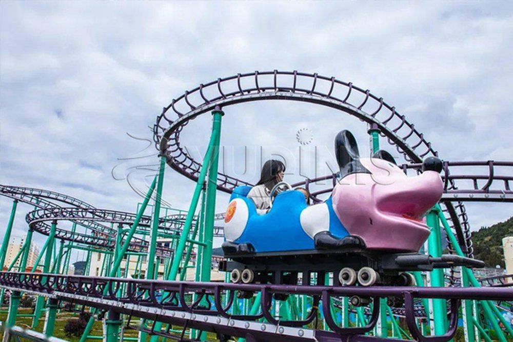 track layout of a crazy mouse spinning coaster in a park