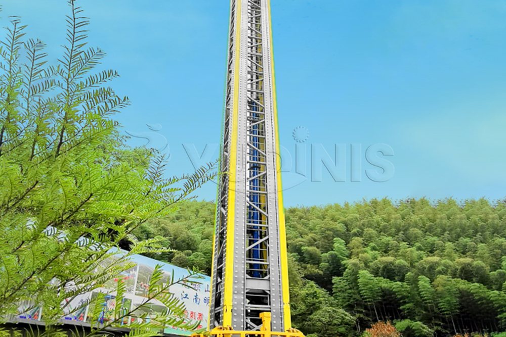 drop tower ride installed outdoors with a rotating gondola