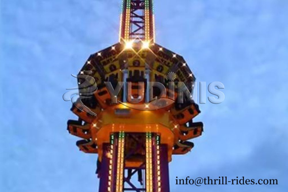 drop tower thrill ride running at an amusement park