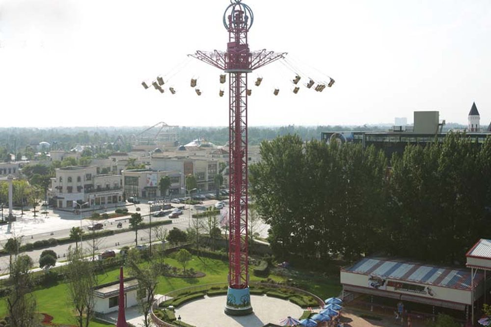 flying sky swing ride at high altitude in an amusement park